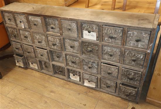 A vintage bank of 32 drawers W.164cm